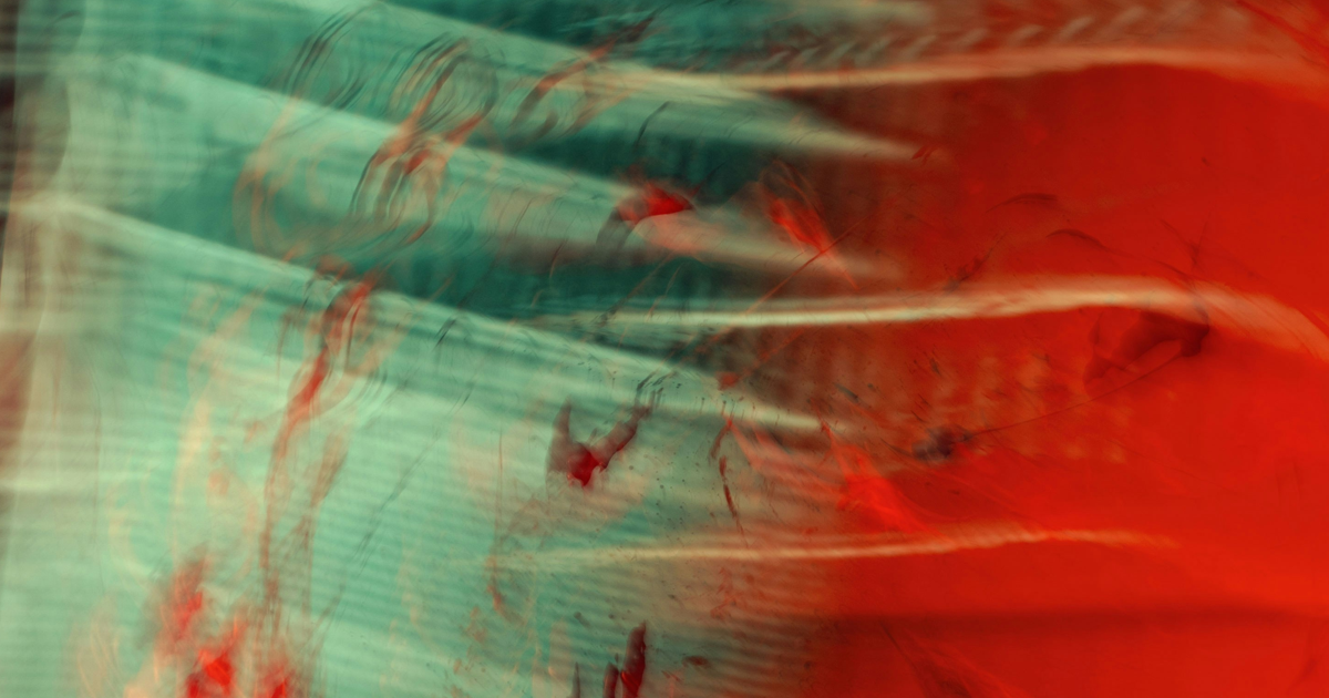 Abstract red and teal light in motion
